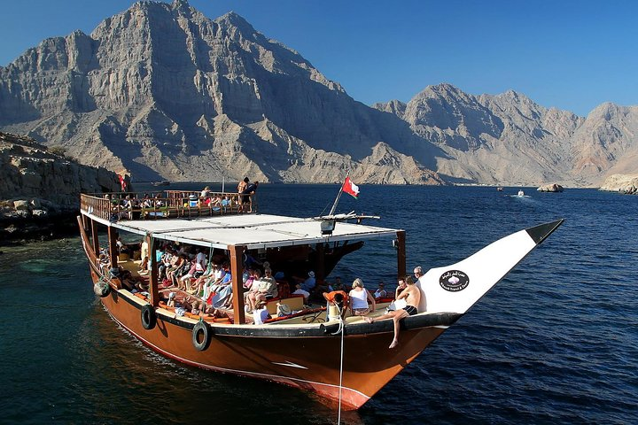 Experience the serene beauty of the Musandam Peninsula aboard a traditional dhow surrounded by majestic mountains and crystal-clear waters perfect for swimming and relaxation. Enjoy a delightful buffet lunch onboard.